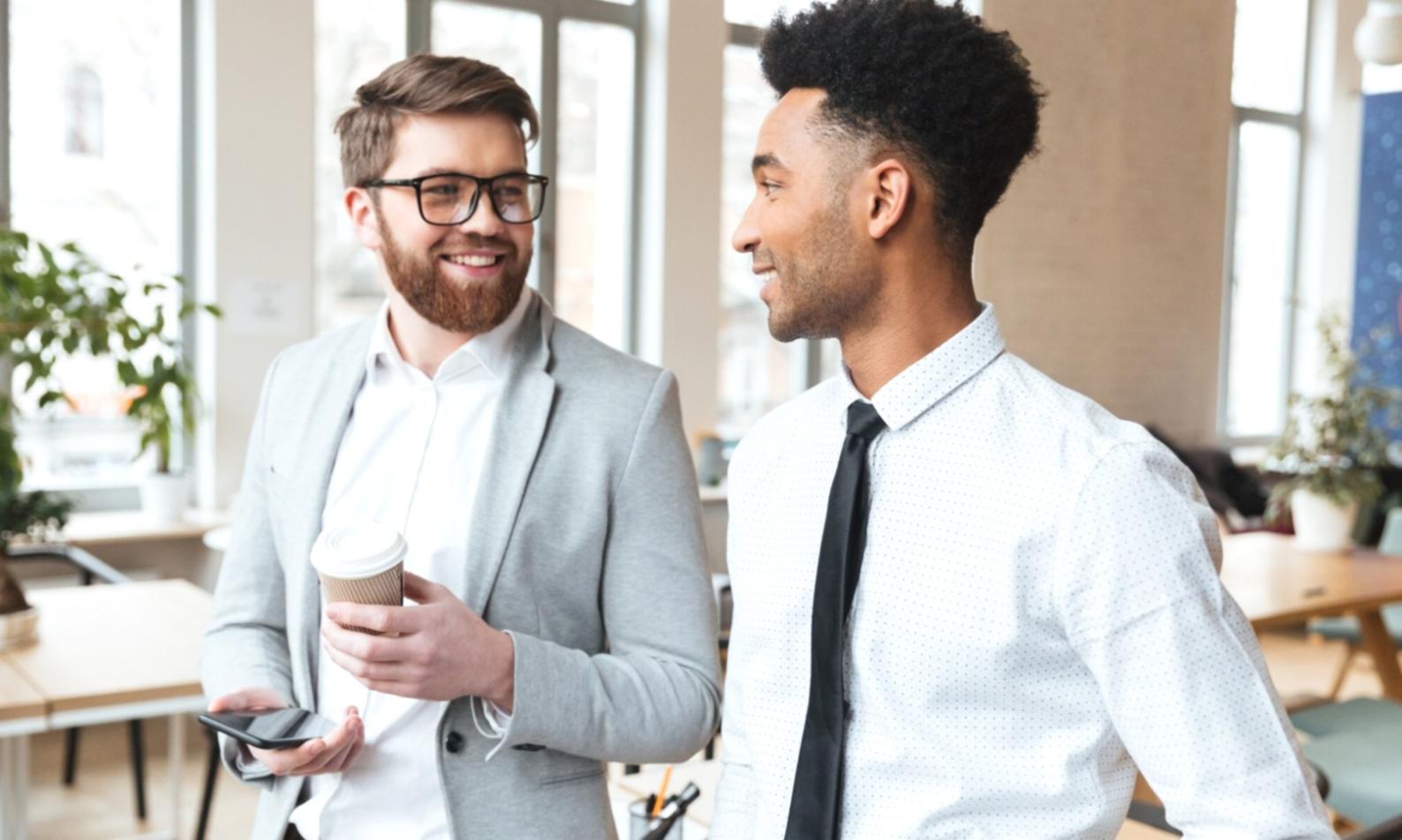 Diverse group of participants reviewing financial planning materials together