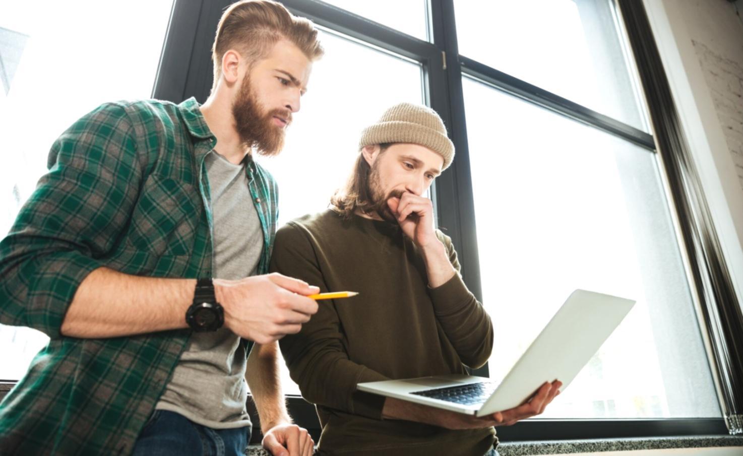 Financial planning materials and seasonal calendar layouts spread across a desk